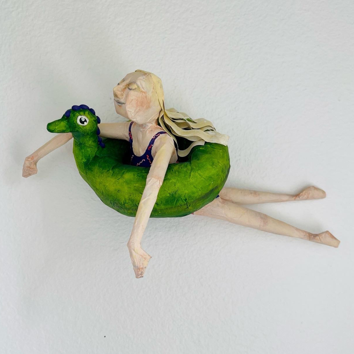 Floating, Paper Mache Girl Floating on Intertube