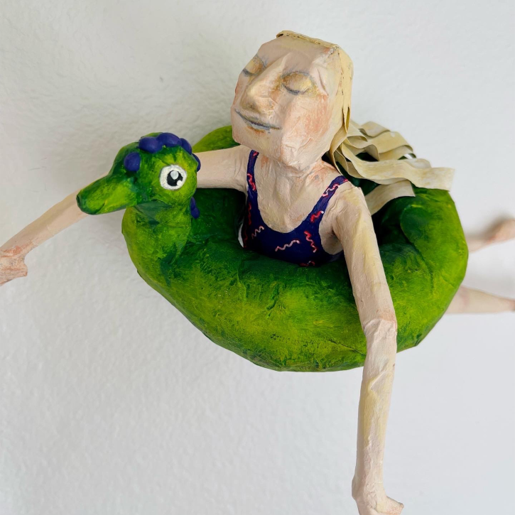 Floating, Paper Mache Girl Floating on Intertube, Detail