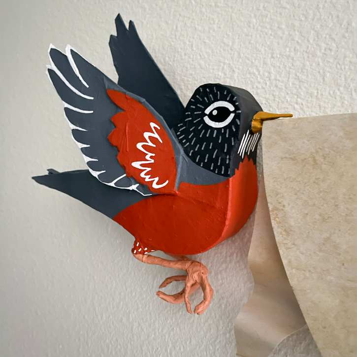 The Robins Are Judging You, Paper Mache Robins Holding This Is Not Important Banner, Detail